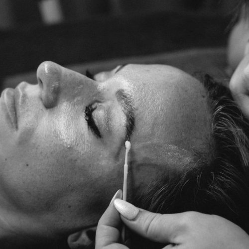 Eyebrows microblading Lamination with buds. Cosmetologist preparing young woman for eyebrow permanent makeup procedure | Ella Esthetics in Alexandria, VA