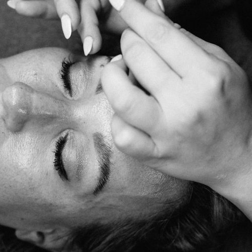 Eyebrows microblading Lamination concept. Cosmetologist preparing young woman for eyebrow permanent makeup procedure | Ella Esthetics in Alexandria, VA